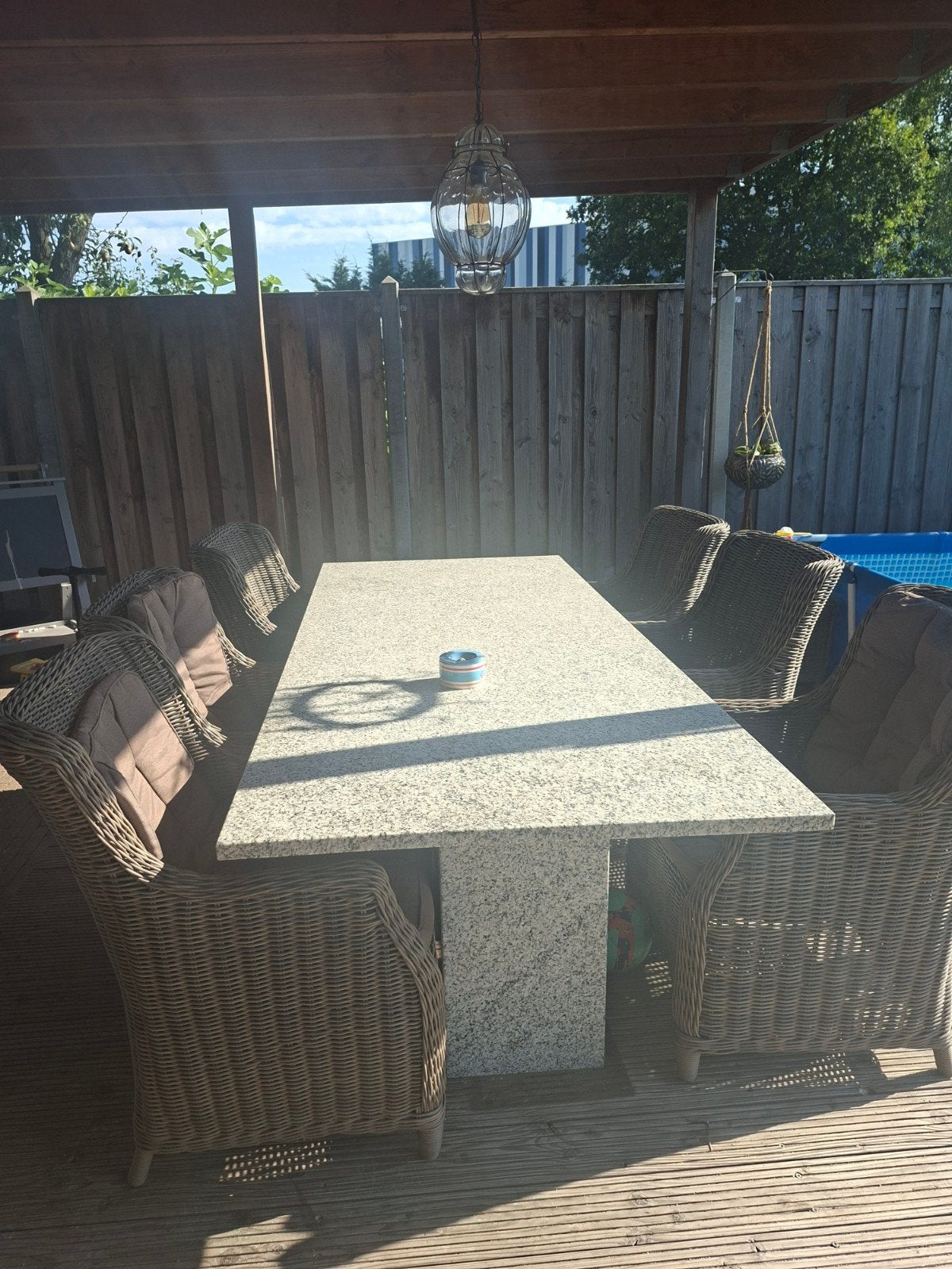 Granieten tuintafel met 6 wicker stoelen, Ophalen of Verzenden