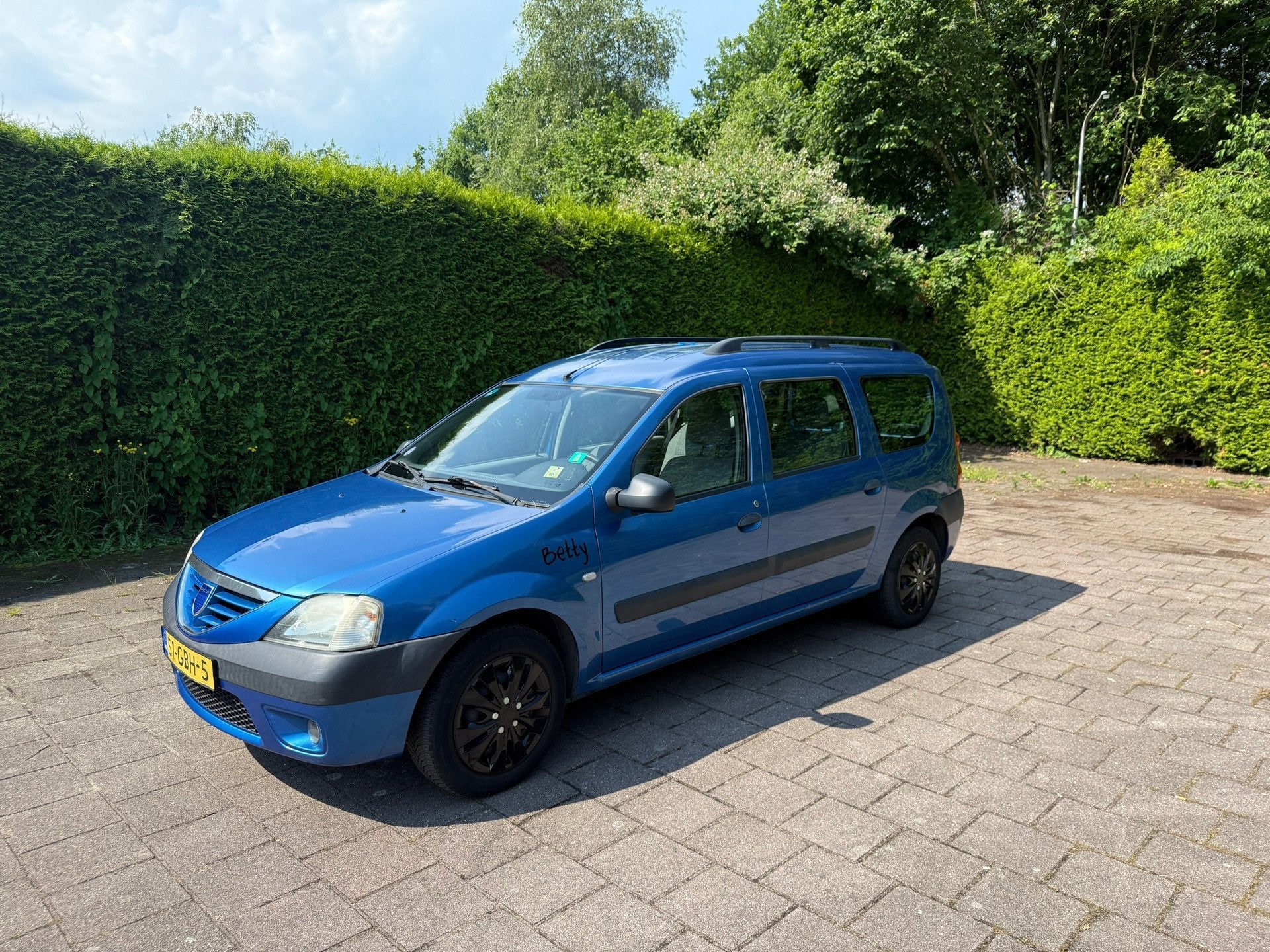 Dacia Logan MCV 1.6-16V Lauréate 7p., Auto's, Gebruikt, 4 cilinders, Blauw, 7 stoelen