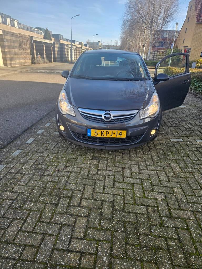 Opel Corsa 1.2 16V 3D 2013 Grijs, Auto's, Opel, Voorwielaandrijving, 40 €/maand, Zwart, 1229 cc