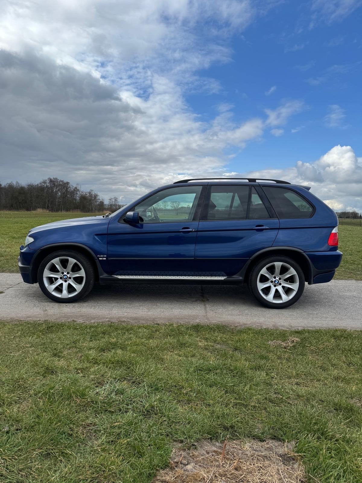 BMW X5 4.8 I AUT 2004 Blauw, Auto's, Automaat, 2175 kg, Blauw, Origineel Nederlands