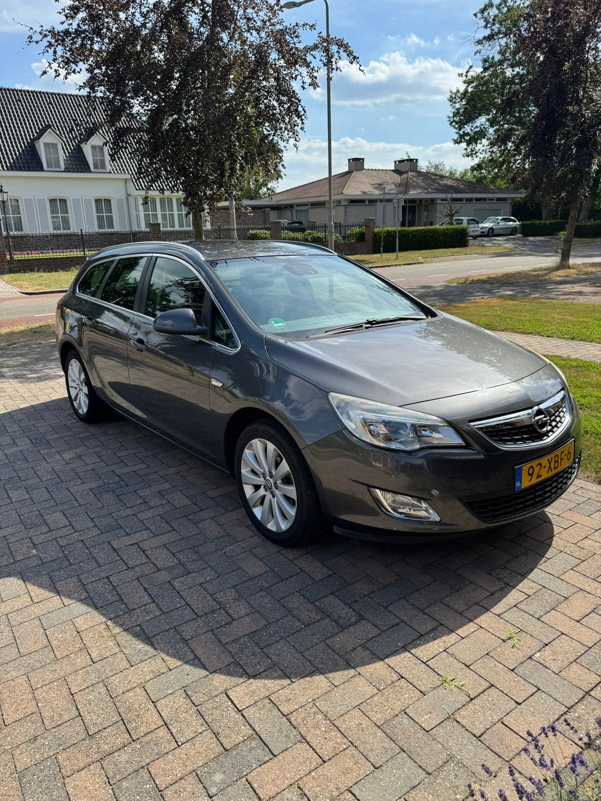 Opel Astra 1.4 Turbo 103KW Sports Tourer 2012 Grijs, Auto's, Voorwielaandrijving, Zwart, 4 cilinders, Leder en Stof