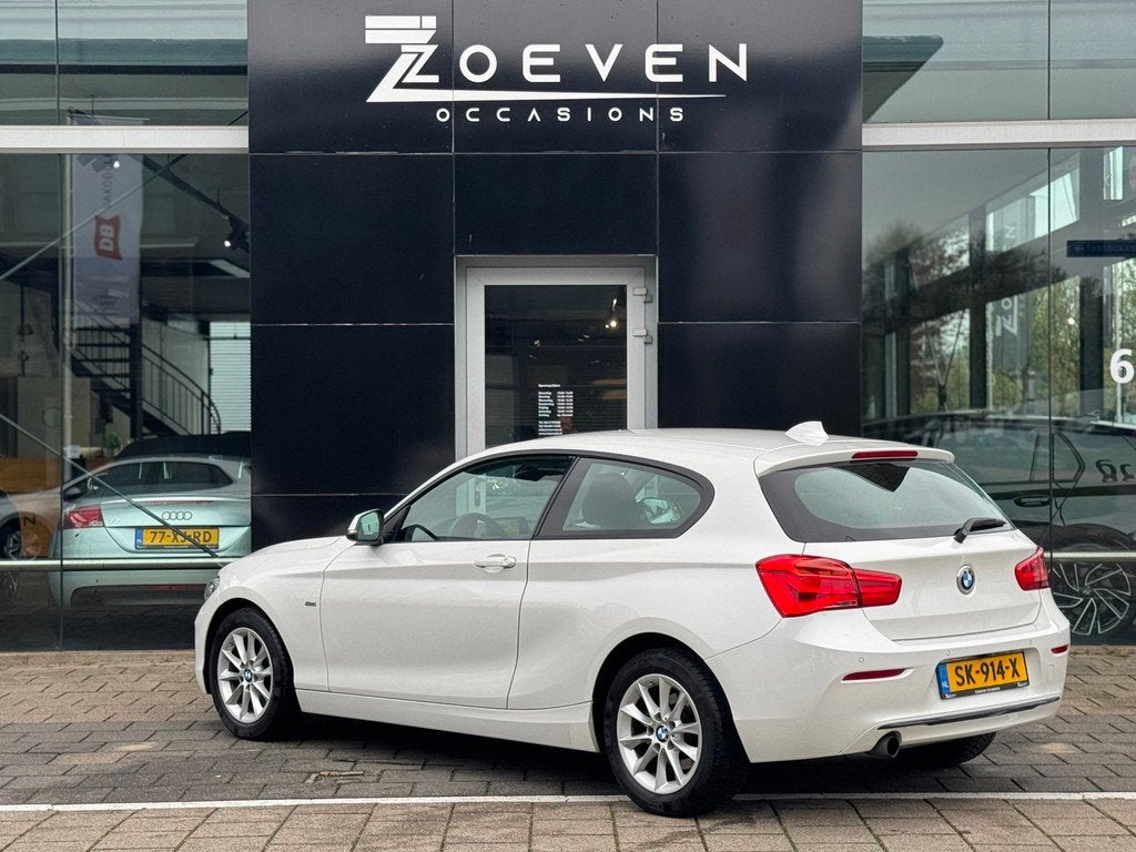 BMW 1-serie 118i Centennial High Executive/ Automaat/Navi, Auto's, Gebruikt, 1290 kg, 4 stoelen, Wit