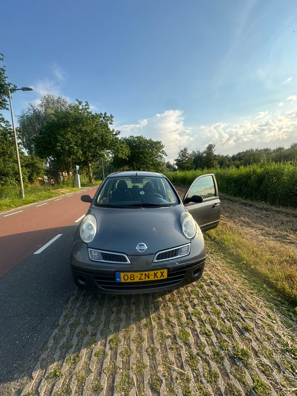 Nissan Micra 1.2 48KW 5DR 2009 Grijs, Auto's, 31 €/maand, 4 cilinders, Origineel Nederlands, Micra
