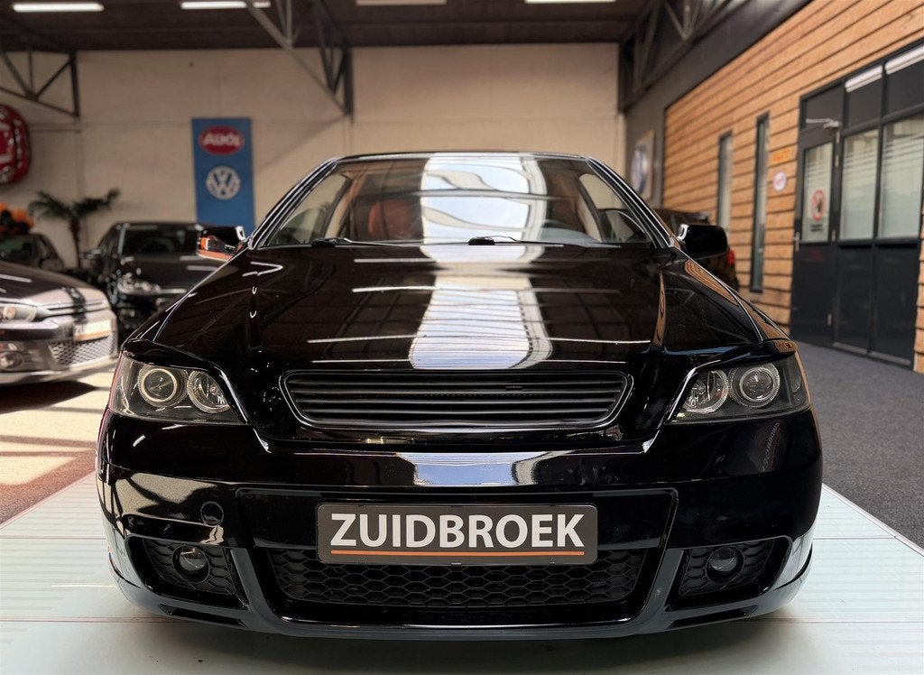 Opel Astra Coupe 1.8 Airco | Stoelverwarming | 18'' Sportvel, Auto's, Elektrische ramen, 116 pk, Zwart, Leder