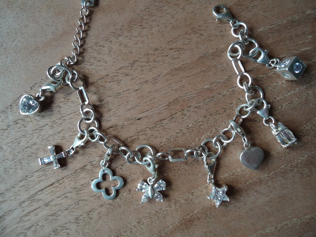 mooi echt zilveren armbandje met 8 hang on bedels 925, Ophalen of Verzenden, Zo goed als nieuw, Zilver, Zilver