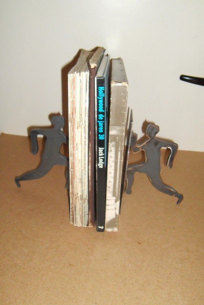 Unieke set boekensteunen,staal,running men,zwaar,design, Antiek en Kunst, Kunst | Designobjecten, Ophalen of Verzenden, Pop/figuur