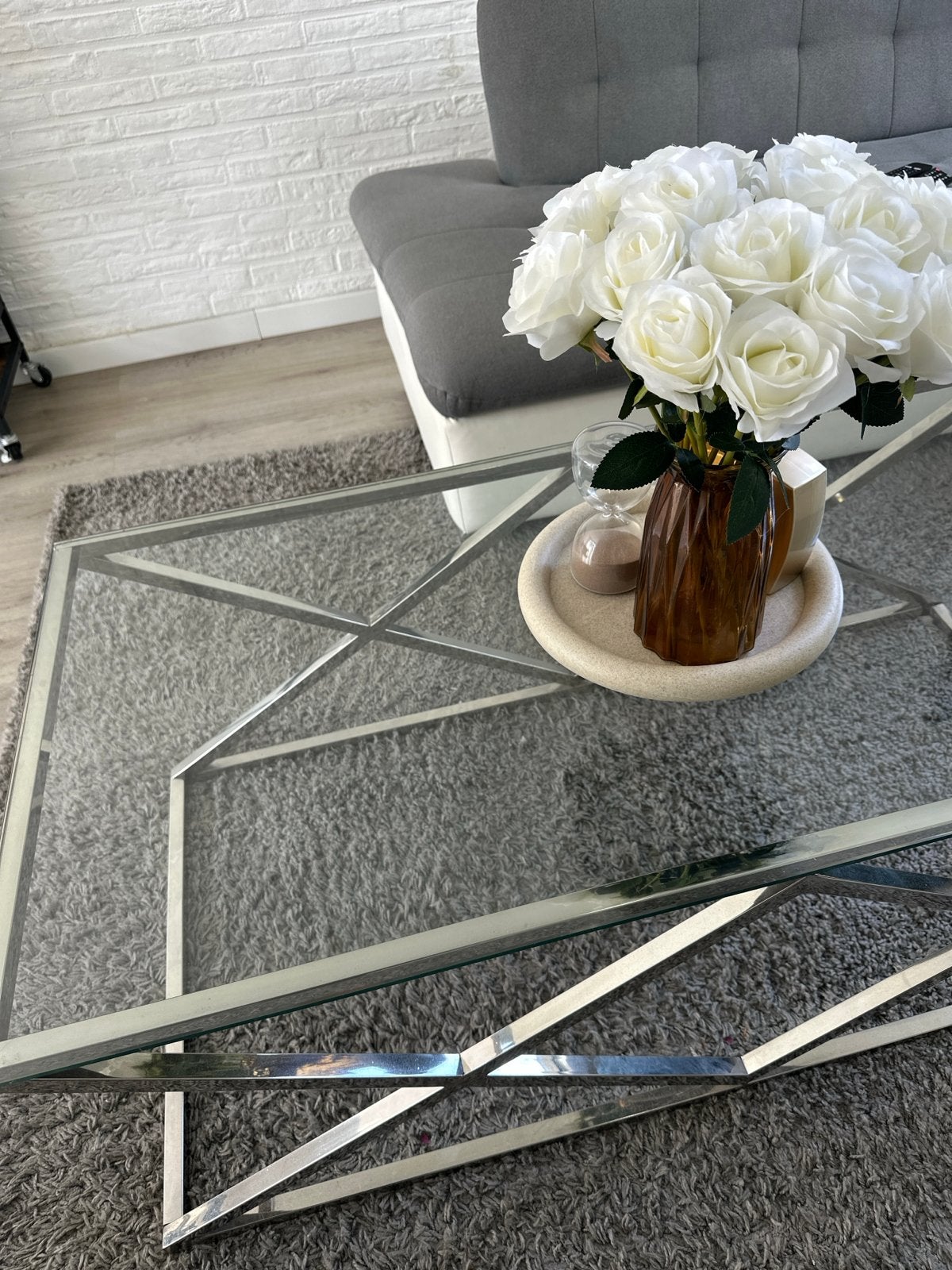 Moderne salontafel met glazen blad en metalen onderstel, Ophalen, Gebruikt, 100 tot 150 cm, 50 tot 100 cm