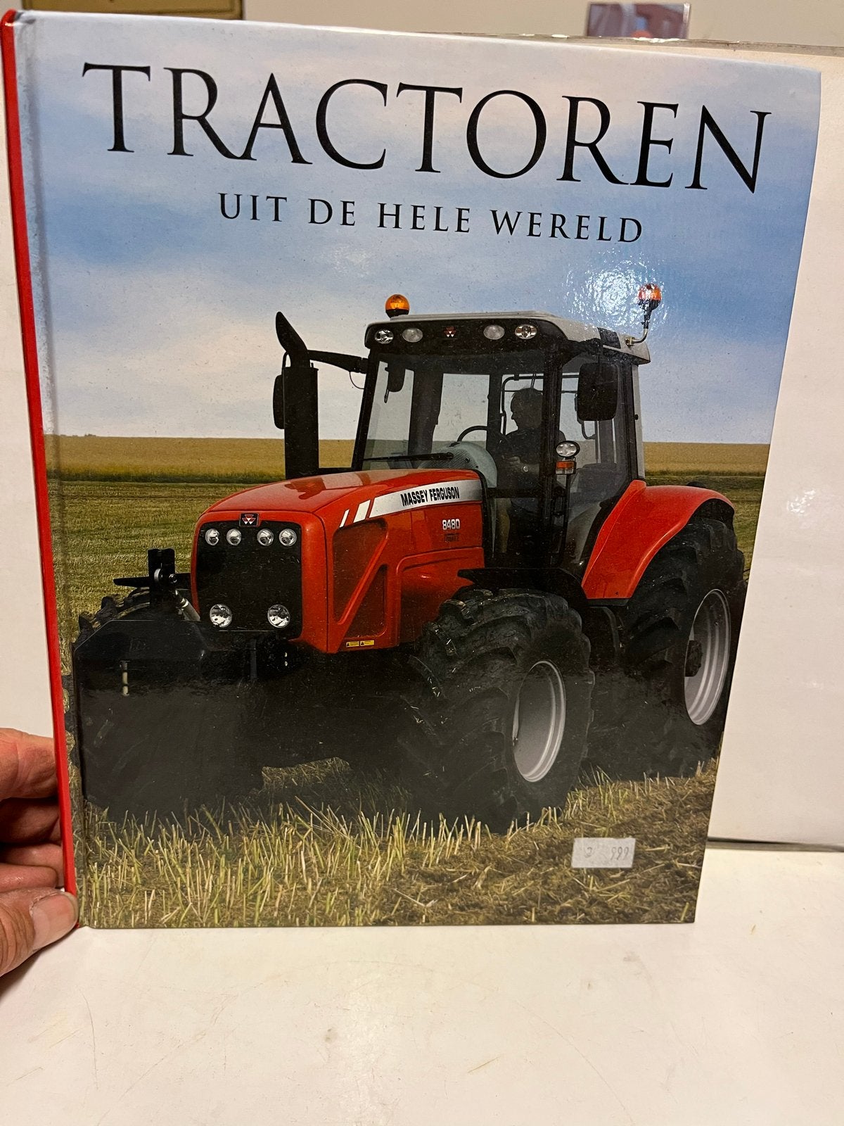 Tractoren uit de hele wereld - Boek over tractoren, Ophalen of Verzenden, Zo goed als nieuw, Algemeen