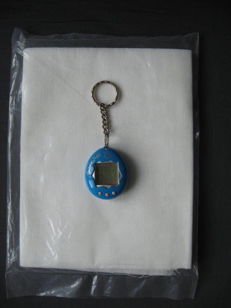 Bandai 1997 - turquoise Tamagotchi (met gebr. aanwijzing), Ophalen of Verzenden, Zo goed als nieuw
