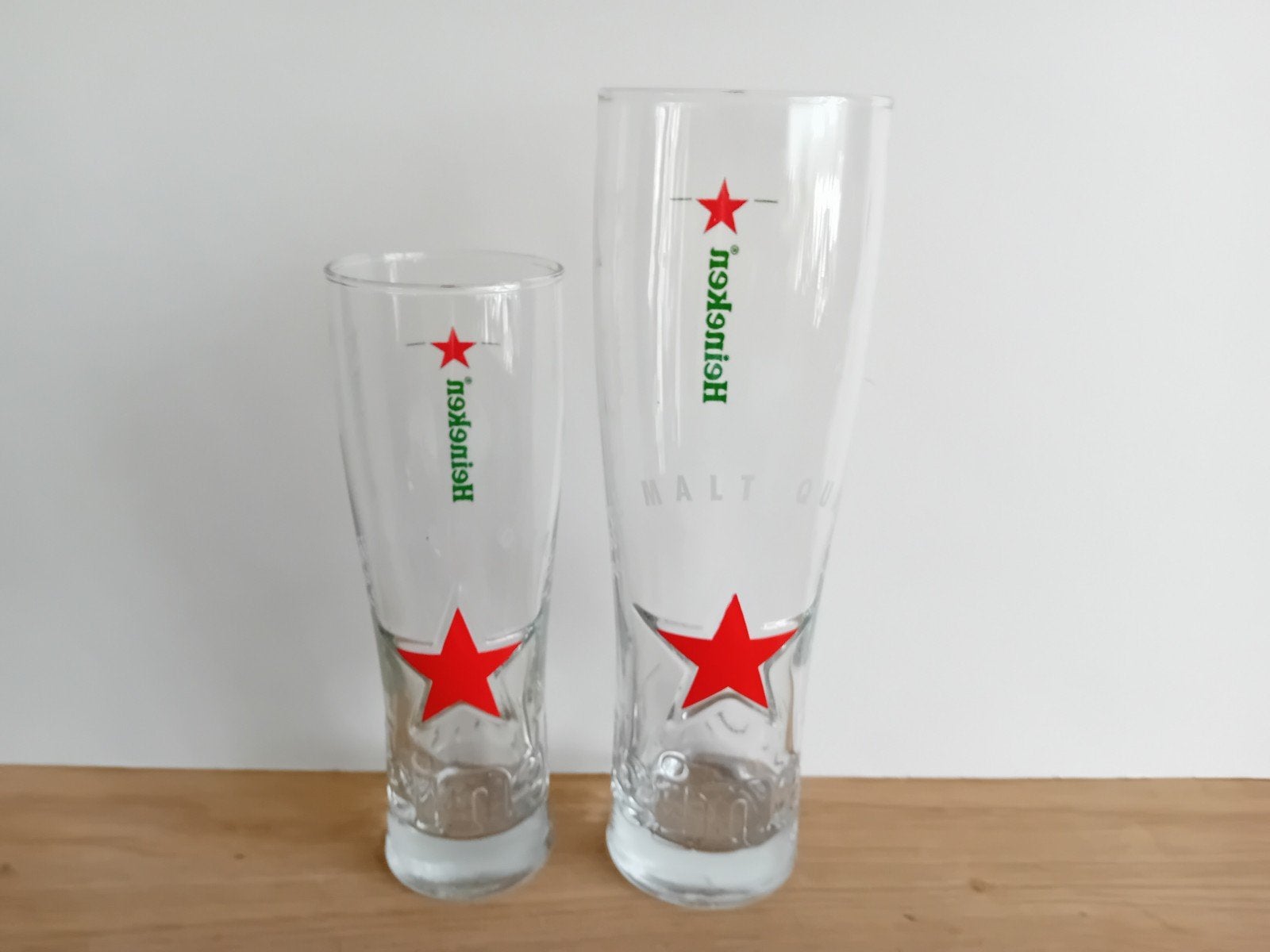 2 Heineken glazen met rode ster 0,25 CL en 0,50 CL, Ophalen of Verzenden, Zo goed als nieuw, Glas of Glazen, Heineken