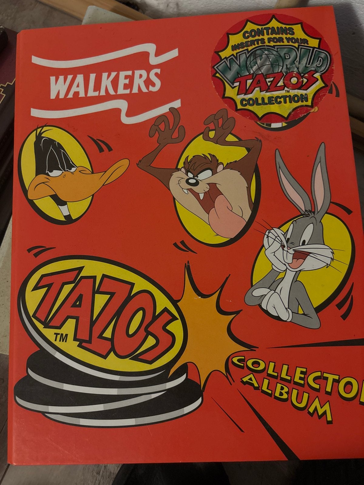 Flippo verzamelmap met Looney Tunes, Jam Caps en Tazo's, Ophalen of Verzenden, Gebruikt