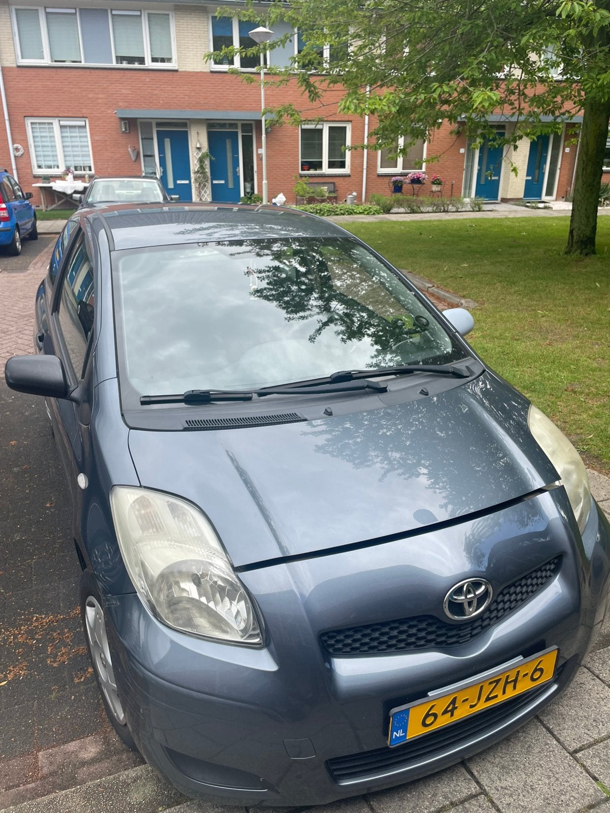 Toyota Yaris 1.0 2009 Blauw/Grijs, Ophalen of Verzenden, Gebruikt, Toyota, Motorkap