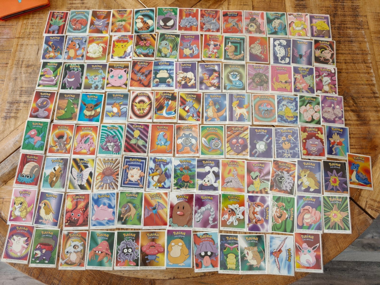 Meer dan 100 Pokemon Dunkin stickers + binder (90% NM), Ophalen of Verzenden, Zo goed als nieuw, Meerdere kaarten, Foil