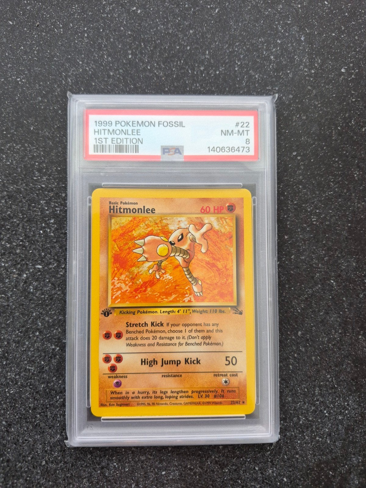 Hitmonlee 1st Edition PSA 8 NM-MT - 1999 Pokémon Fossil, Ophalen of Verzenden, Zo goed als nieuw, Losse kaart