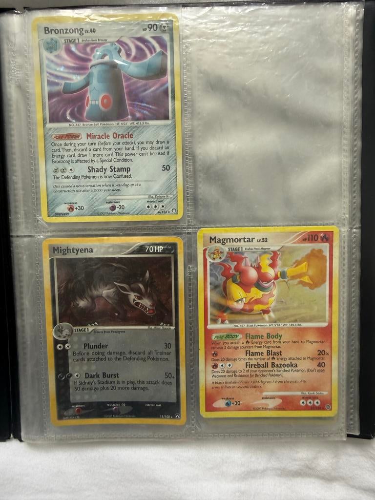 Pokémon kaarten Magmortar, Mightyena, Bronzong en 5 Sleeves, Ophalen, Gebruikt, Meerdere kaarten