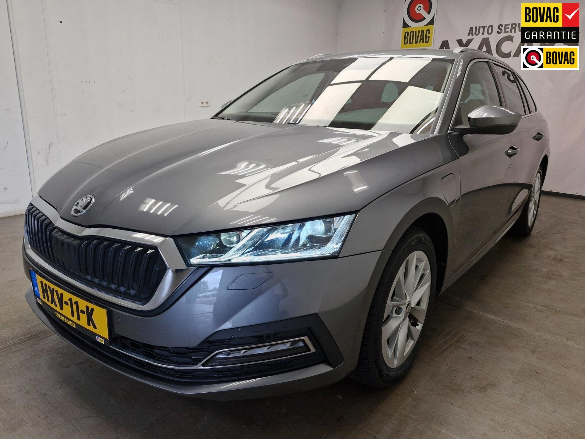 Skoda Octavia Combi 1.4 TSI iV PHEV Sportline Business 12 MA, Auto's, Dealer onderhouden, Gebruikt, Euro 6, 4 cilinders