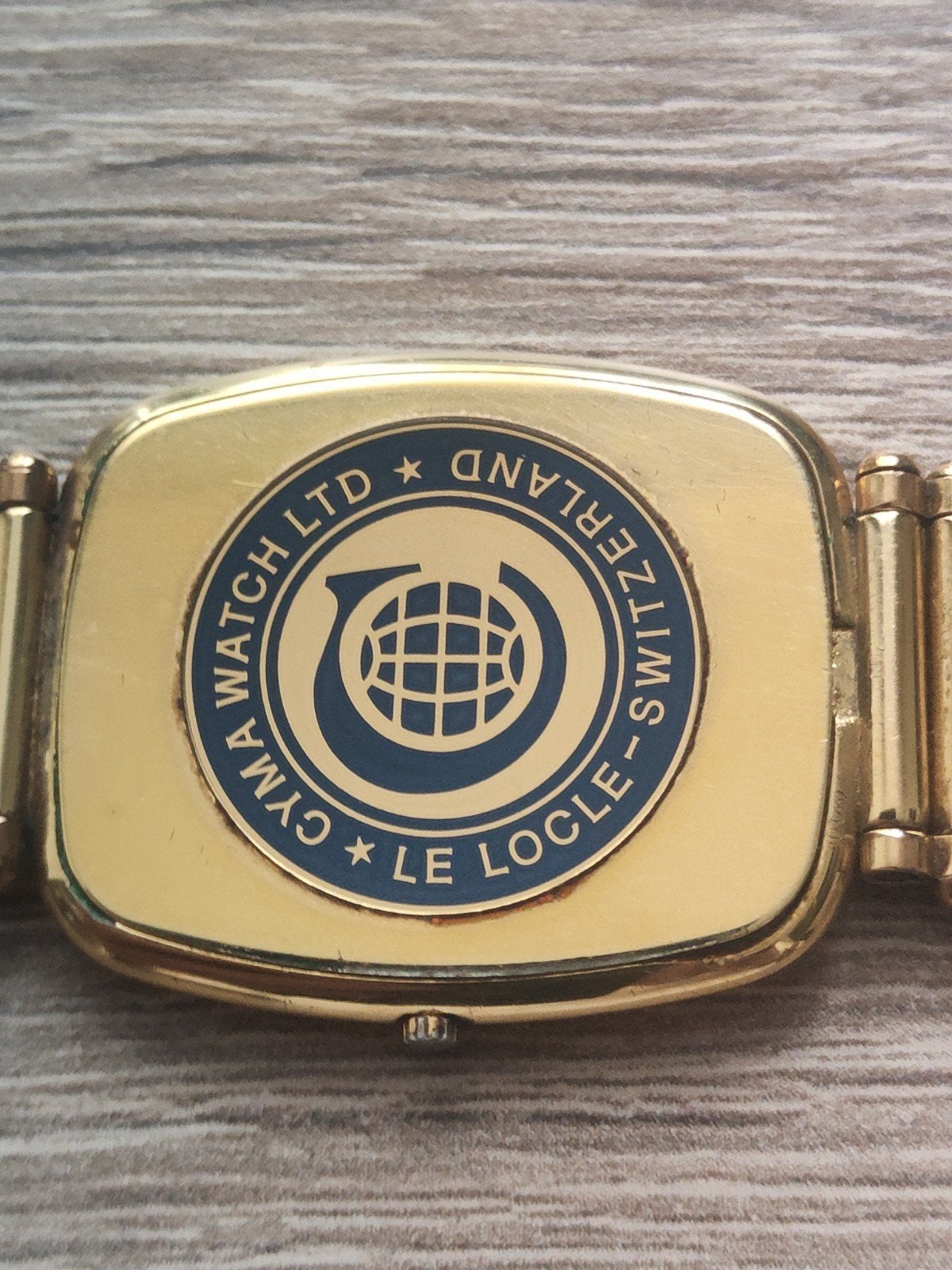 Cyma Quartz horloge - Goudkleurig met zwart wijzerblad, Ophalen of Verzenden