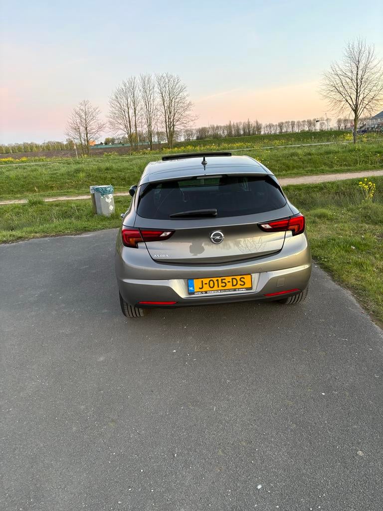Opel Astra 1.2 Turbo 145pk Start/stop 2020 Grijs, Auto's, Voorwielaandrijving, Zwart, 1199 cc, 620 kg