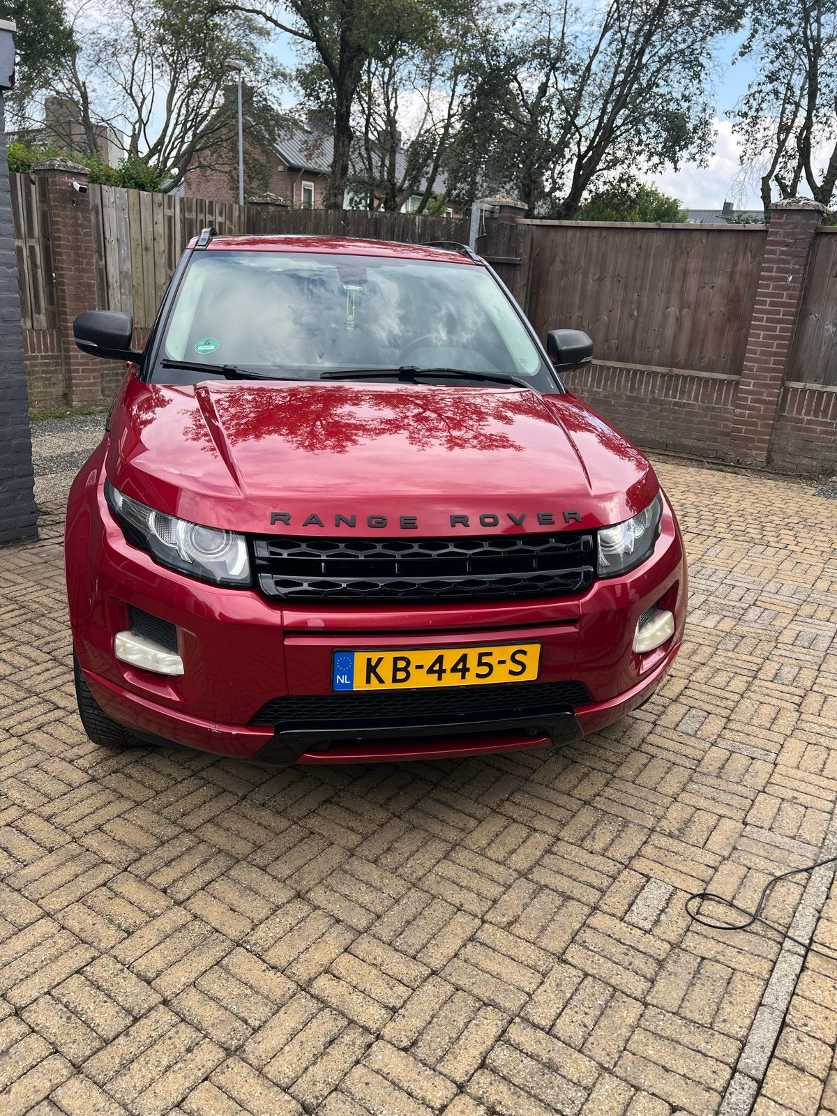 Land Rover Range Rover Evoque 2.2 TD4 4WD AUT 2012 Rood, Auto's, Automaat, 15 km/l, 1800 kg, Zwart