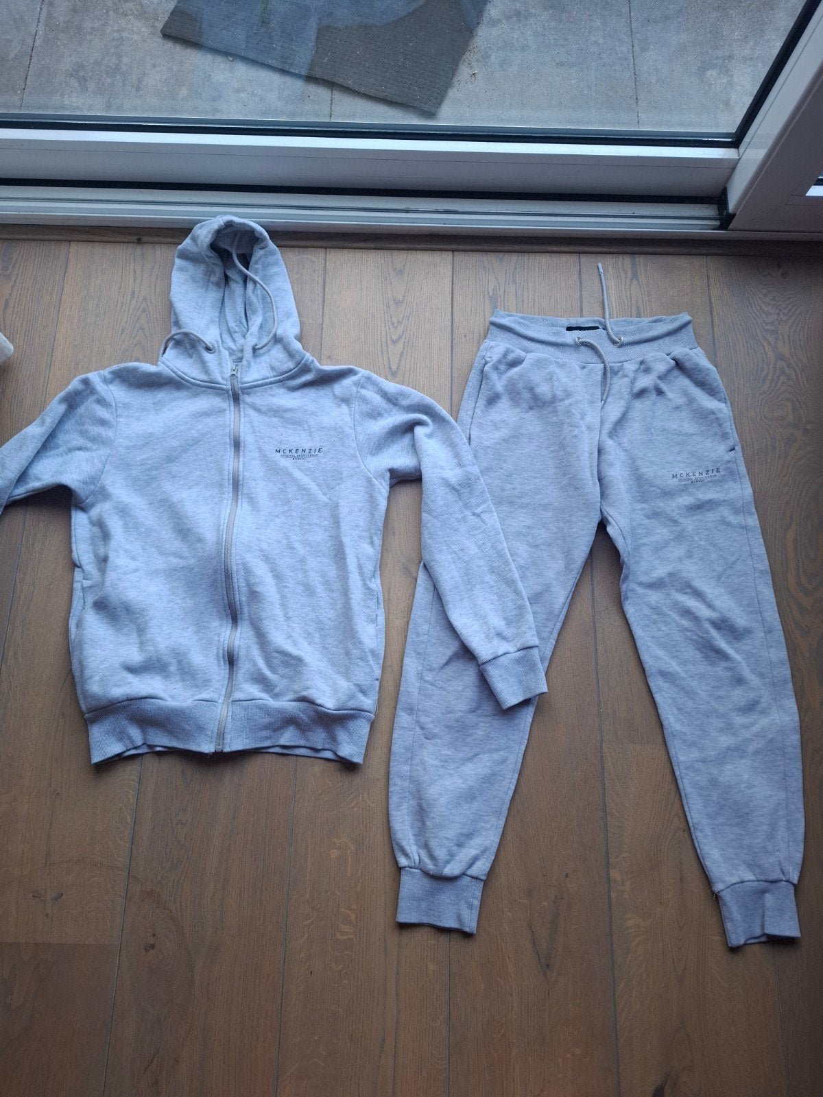 McKenzie trainingspak maat M - grijs, Maat 48/50 (M), Ophalen of Verzenden, McKenzie, Grijs