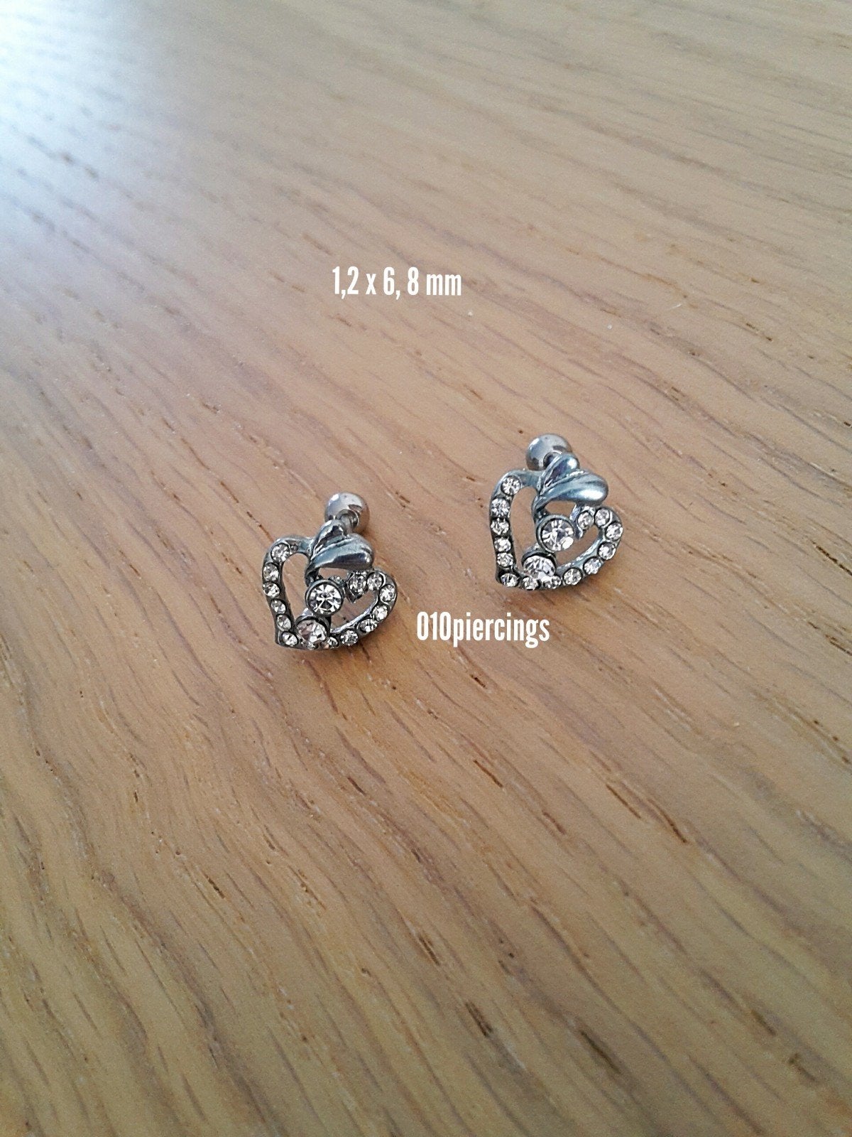 Nieuwe oorpiercing, oorbellen. Tragus, helix. Hartje, appel., Sieraden, Tassen en Uiterlijk, Piercings, Ophalen of Verzenden, Zo goed als nieuw
