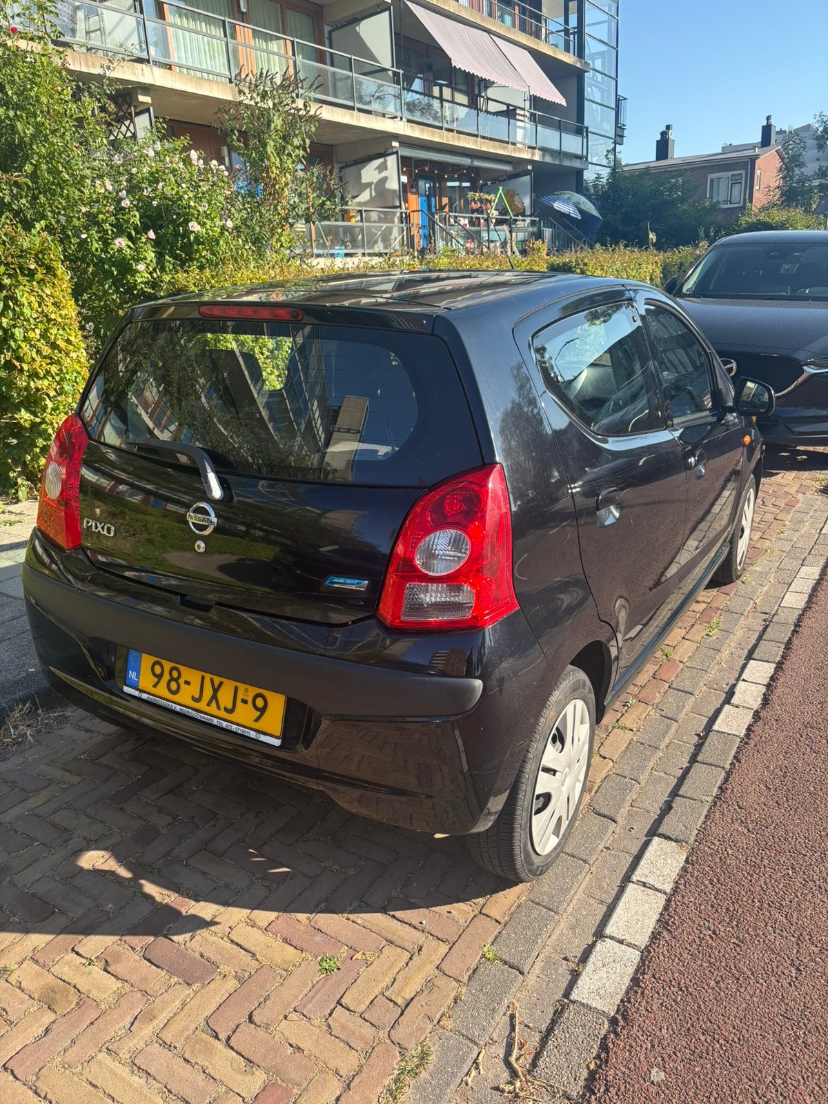 Nissan Pixo 1.0 50KW 5D 2010 Zwart, Auto's, Voorwielaandrijving, 200 kg, 4 stoelen, Origineel Nederlands