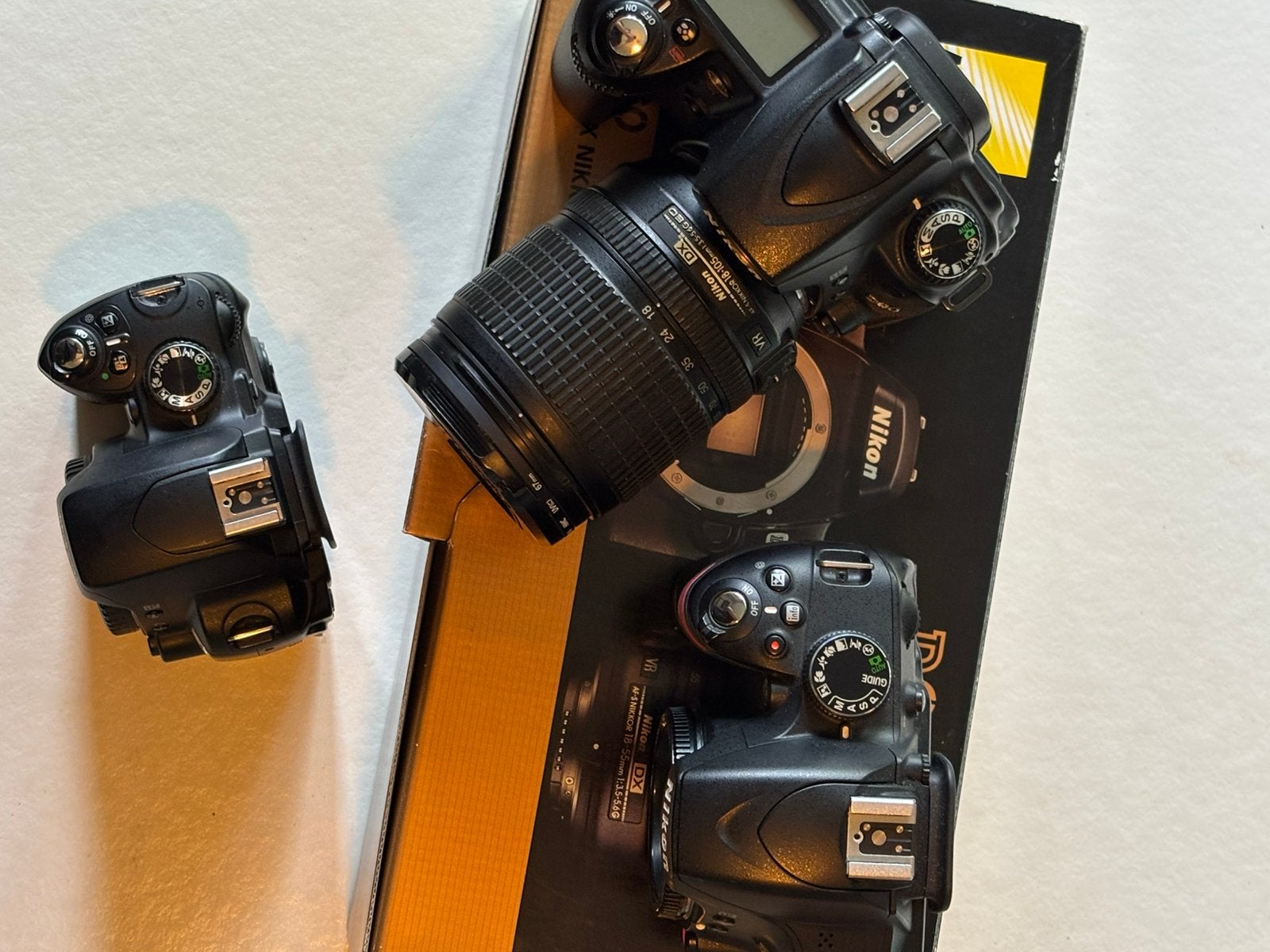 Nikon D90 + D60 + D3200 + Nikkor 18-105mm VR, Audio, Tv en Foto, Gebruikt, Spiegelreflex, Ophalen of Verzenden, Bodydop