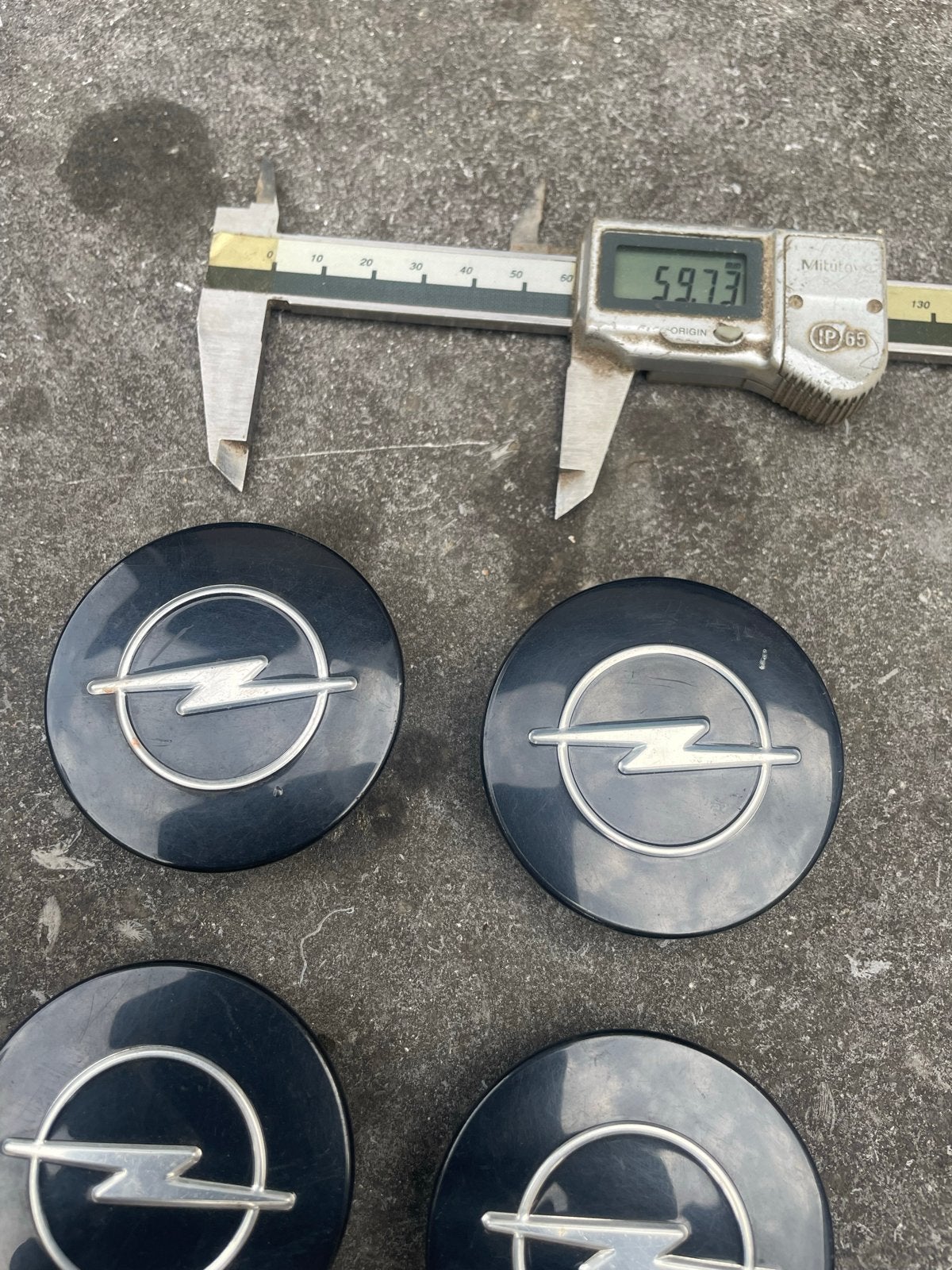 Opel naafdoppen 57mm zwart origineel (set van 4), Ophalen of Verzenden, Gebruikt