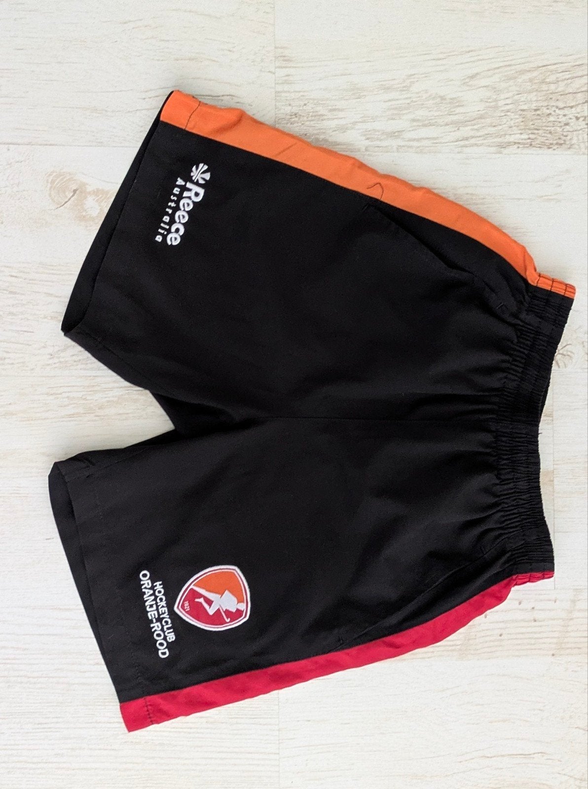 Reece Hockeybroekje Oranje Rood Maat 152 ( jongens), Ophalen of Verzenden, Gebruikt, Kleding