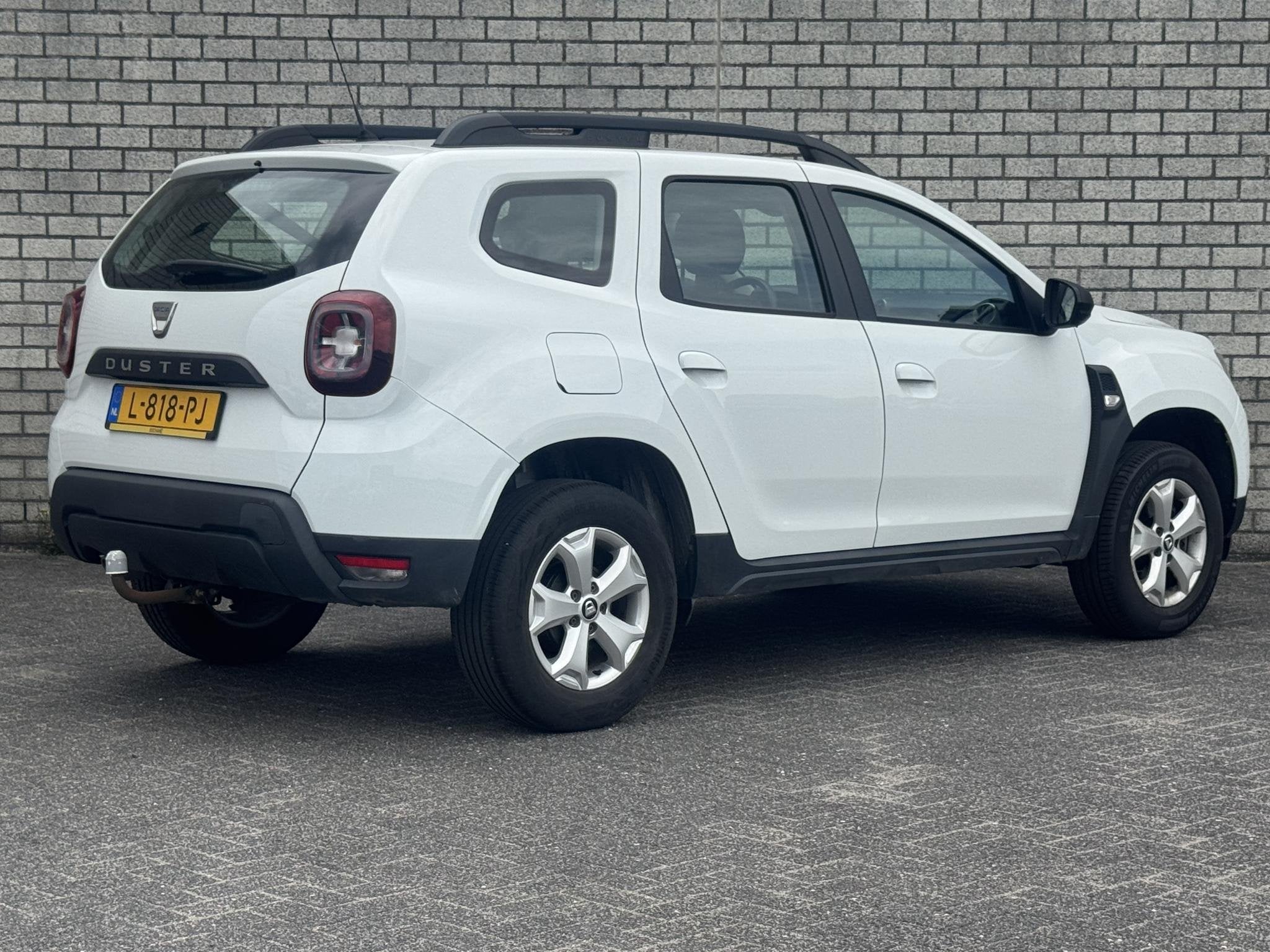 Dacia Duster 1.0 TCe Bi-Fuel Comfort | Trekhaak | Navigatie, Auto's, Gebruikt, 4 cilinders, Wit, Origineel Nederlands