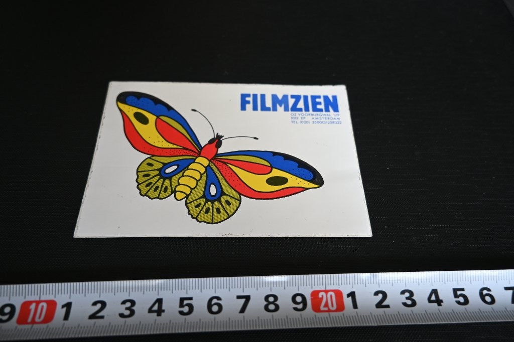 sticker Amsterdam FILMZIEN OZ Voorburgwal 129 Vlinder, Verzamelen, Ophalen, Zo goed als nieuw