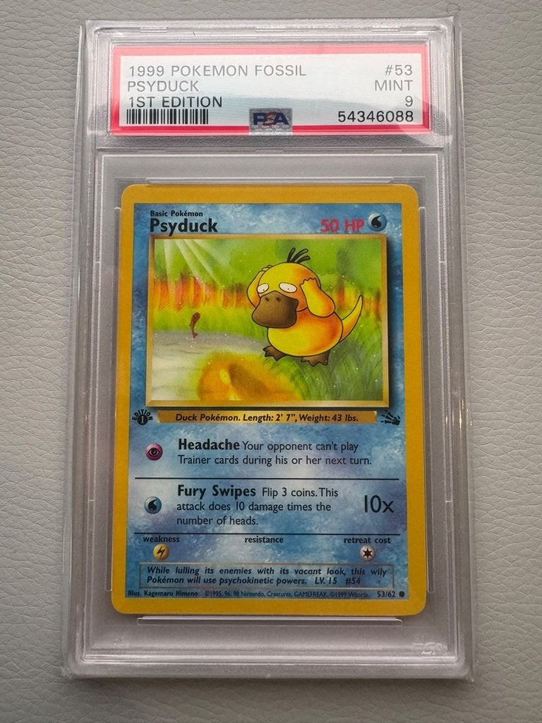 Psyduck 1999 Fossil [1st] PSA 9, Ophalen of Verzenden, Zo goed als nieuw, Losse kaart