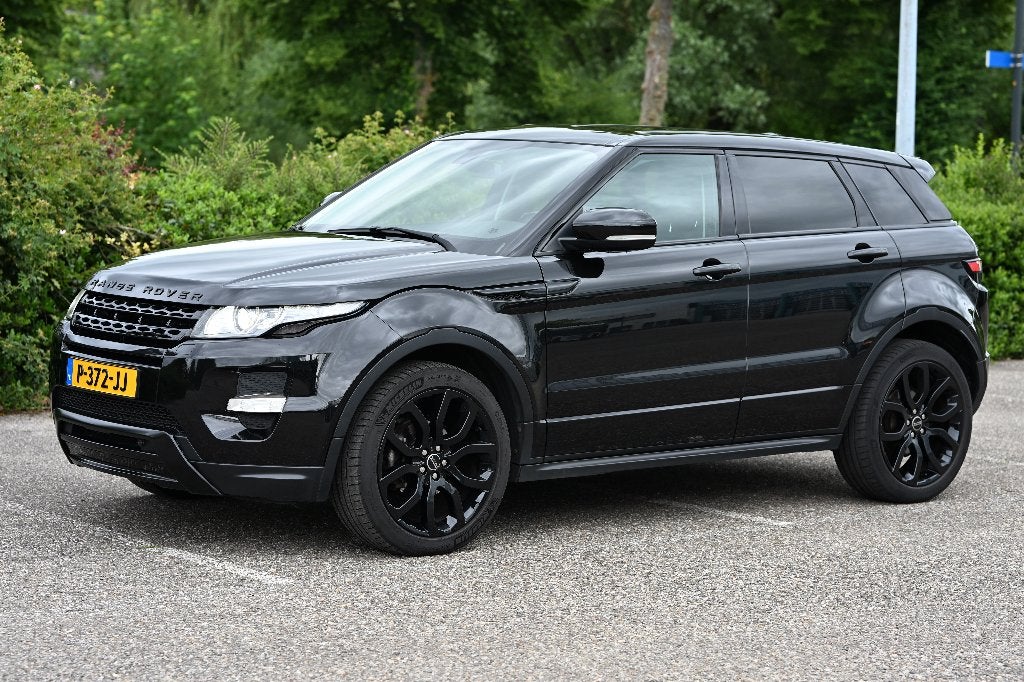 Land Rover Range Rover Evoque SI4 4WD AUT 2012 Zwart, Auto's, Land Rover, Automaat, Euro 5, 1800 kg, Zwart