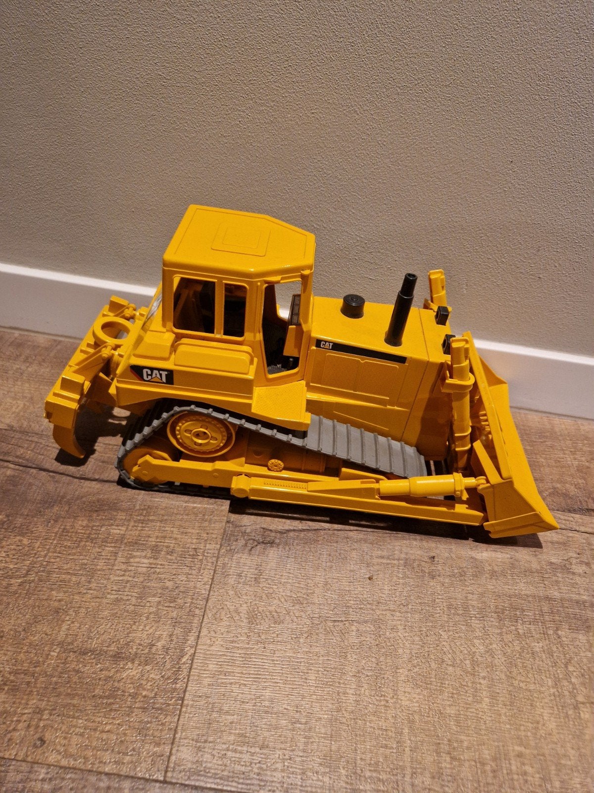 Gele Caterpillar bulldozer speelgoed, Ophalen of Verzenden, Gebruikt