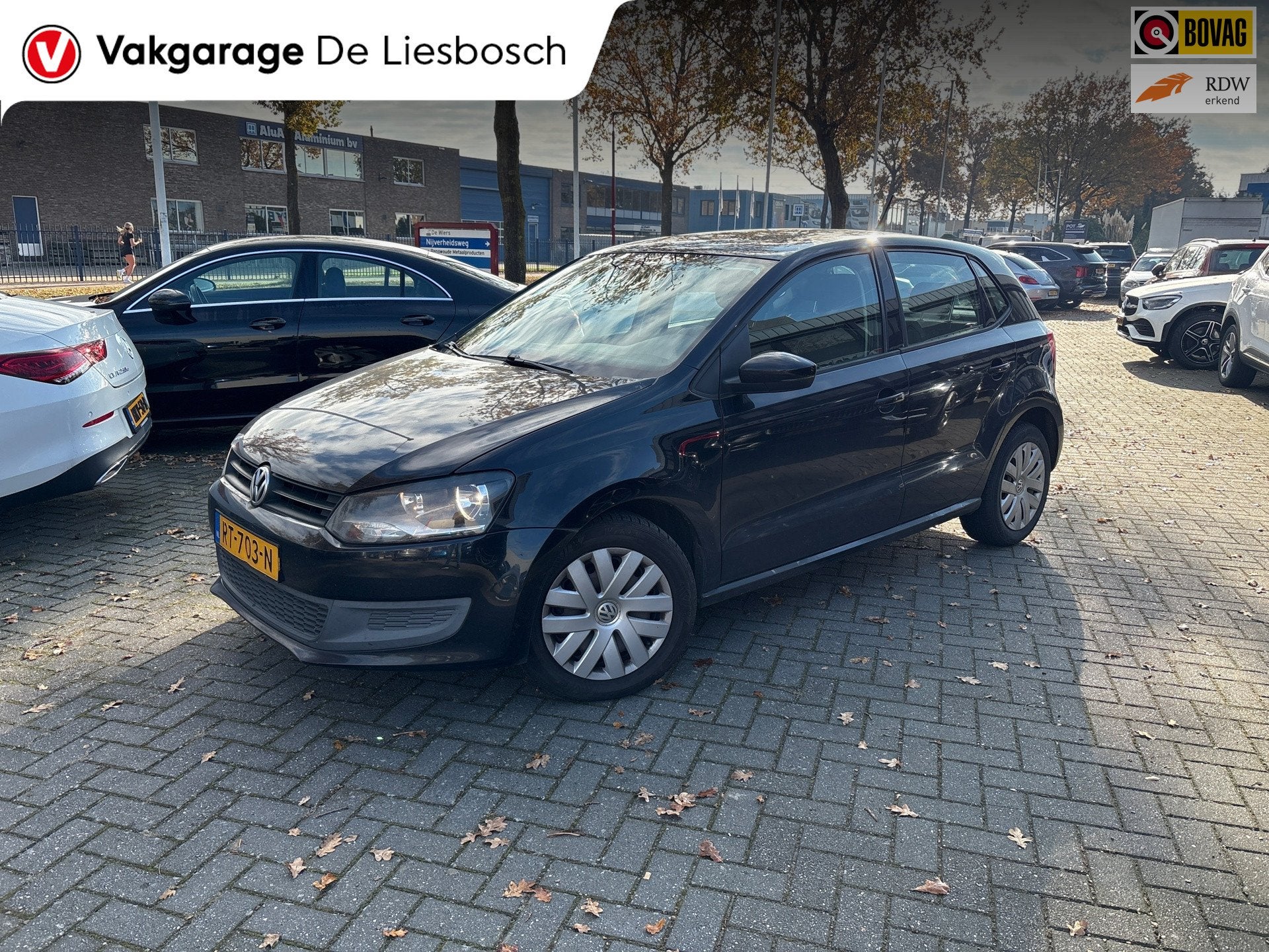 Volkswagen Polo 1.2-12V Comfortline/airco/navi/pdc/boeken/5, Auto's, Voorwielaandrijving, Euro 5, 1198 cc, Zwart