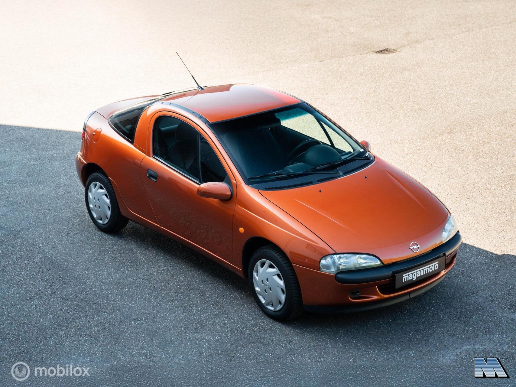 Opel Tigra 1.4i-16V | 1e eign. | Apache Metallic | ZGAN, Auto's, Opel, Voorwielaandrijving, Stof, Gebruikt, Zwart