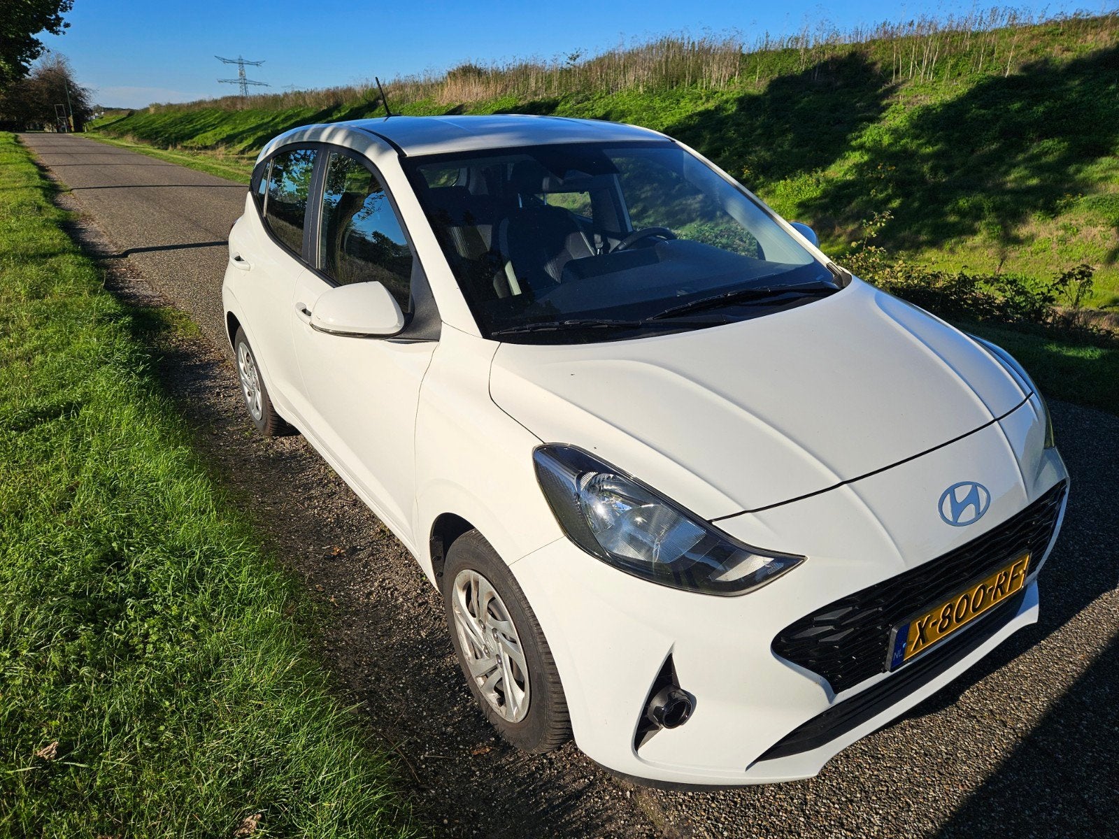 Hyundai i10 1.0i 67pk 2024 Wit, Auto's, 31 €/maand, 899 kg, 4 stoelen, Wit