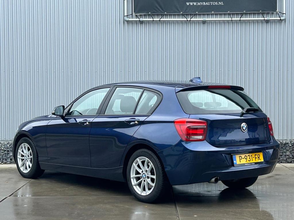 BMW 1-serie 116i High Executive, navi, stoelverwarming, crui, Auto's, BMW, Euro 5, Gebruikt, 4 cilinders, Blauw