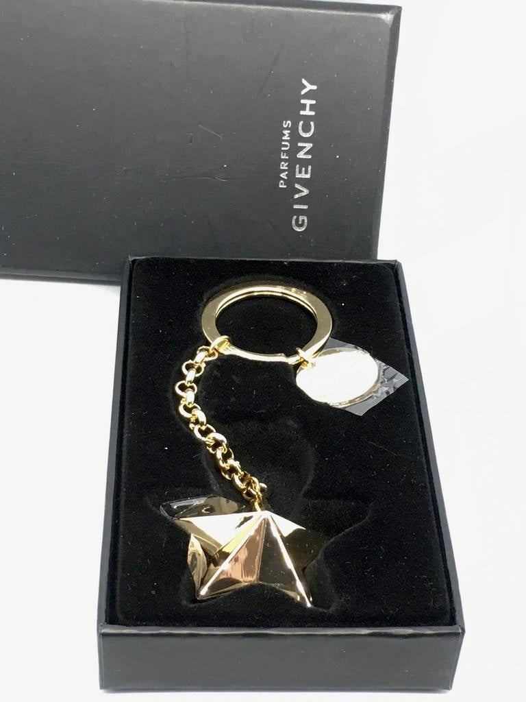 Mooie nieuwe sleutelhanger van Givenchy Parfums in doos, Ophalen of Verzenden, Nieuw, Merk