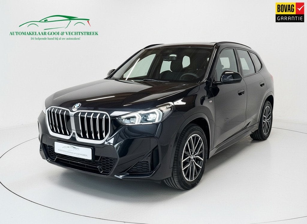 BMW X1 XDrive25e - Panorama - Trekhaak - Memory, Auto's, 12 maanden, Gebruikt, Zwart, Leder en Stof