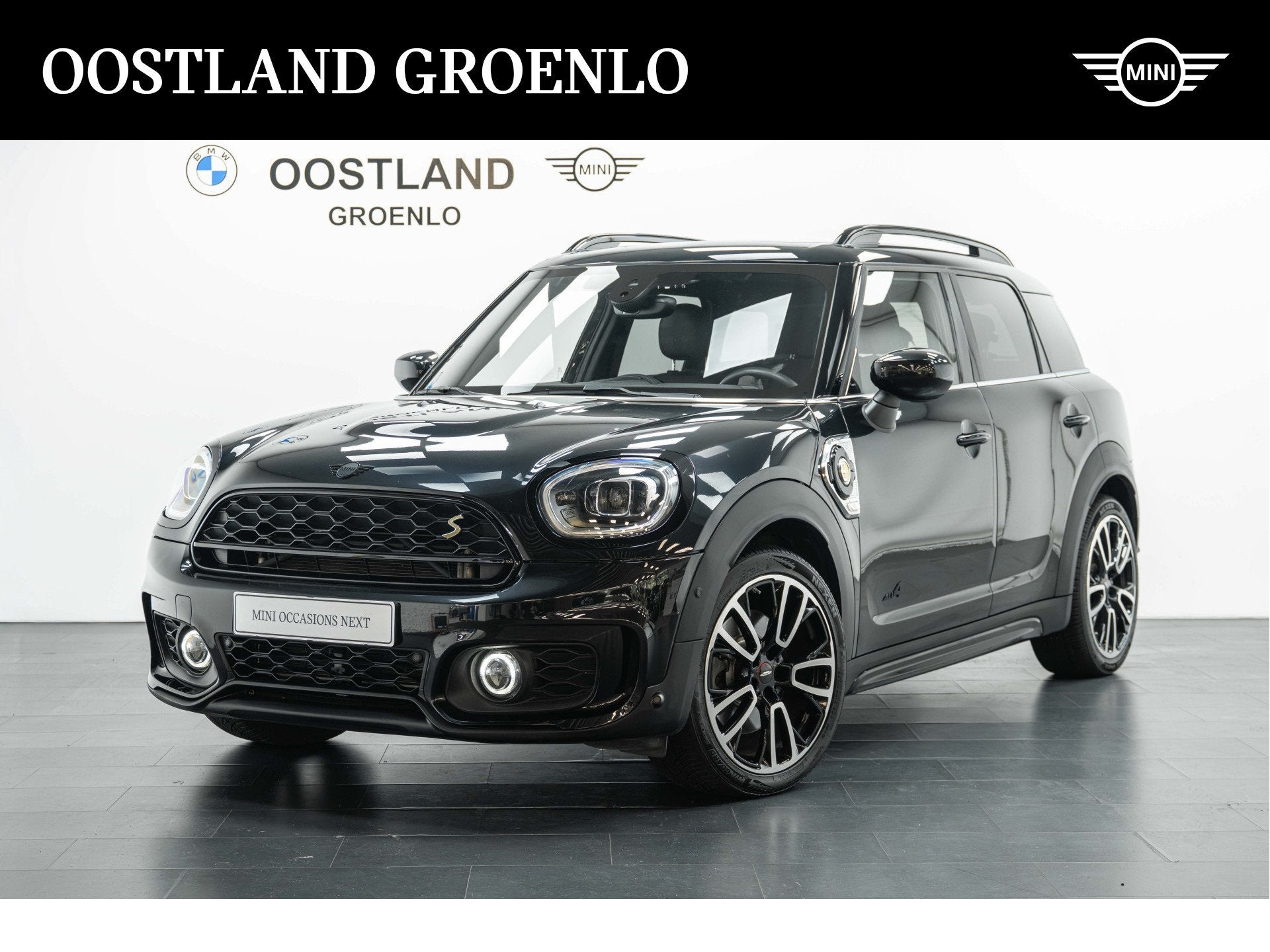 MINI Countryman Cooper S E ALL4 JCW Automaat / Panoramadak /, Auto's, Automaat, Gebruikt, Countryman, Zwart