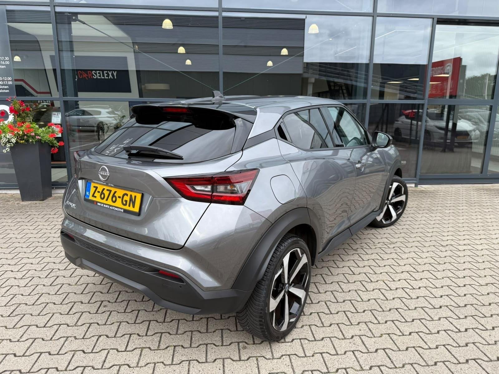 Nissan Juke 1.0 DIG-T Tekna *Bose & ACC*, Auto's, 12 maanden, Euro 6, Leder en Stof, Bedrijf