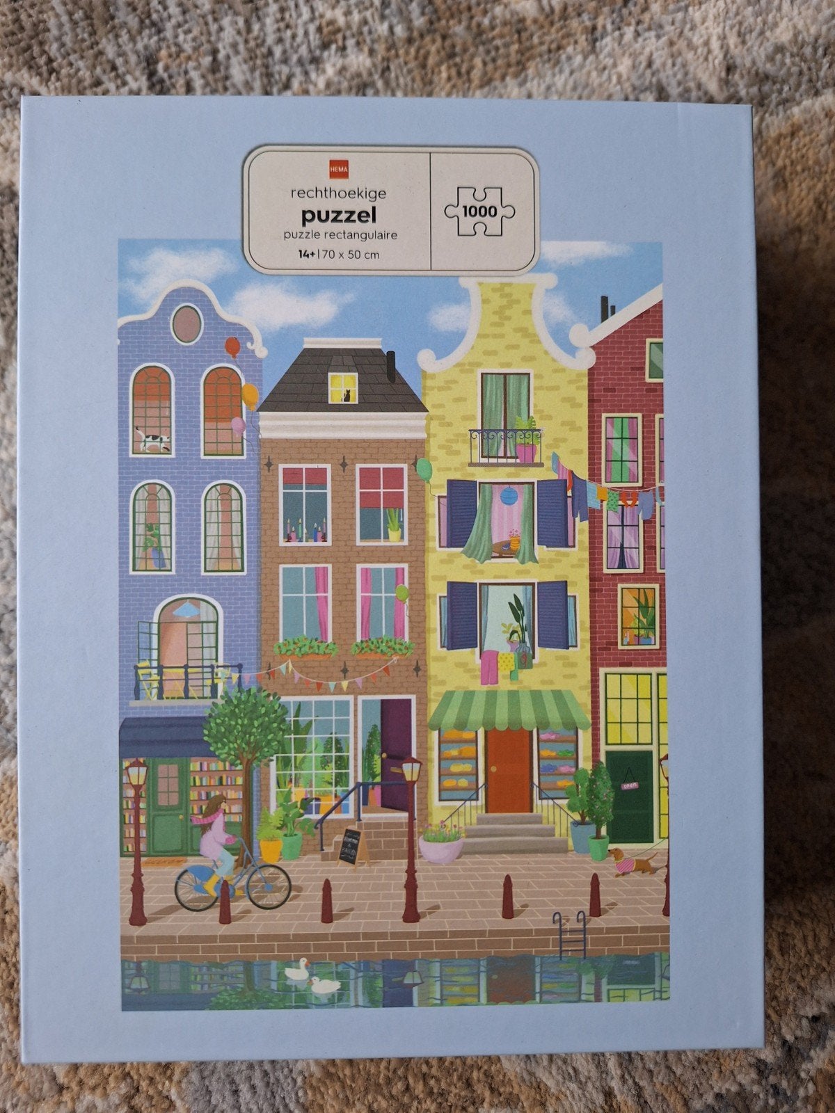 Hema Puzzel 1000 stukjes - Straatje met leuke gevels, Hobby en Vrije tijd, Denksport en Puzzels, Ophalen of Verzenden, 500 t/m 1500 stukjes