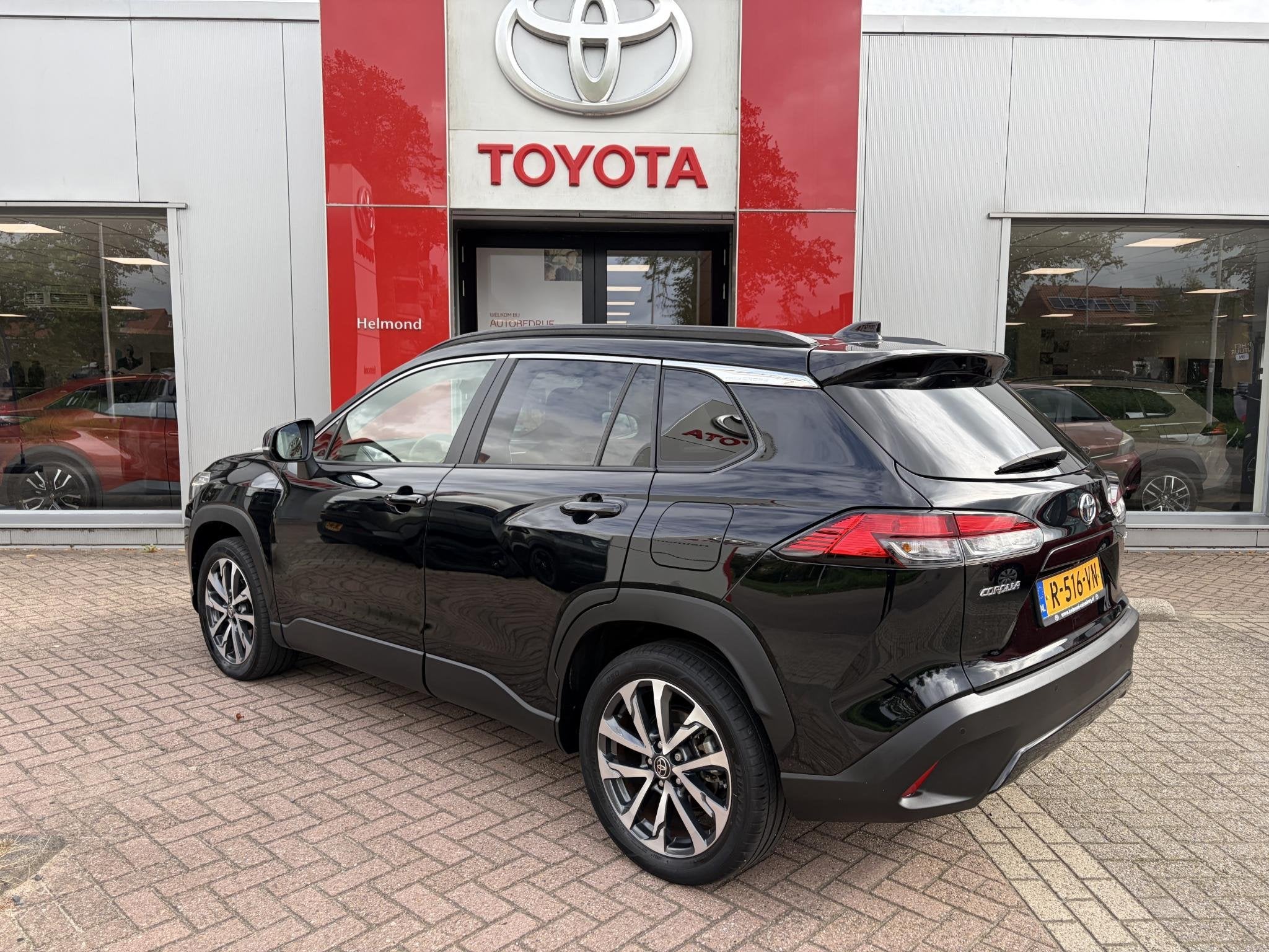 Toyota Corolla Cross 2.0 High Power Hybrid First Edition, Auto's, Gebruikt, 4 cilinders, Leder en Stof, Zwart