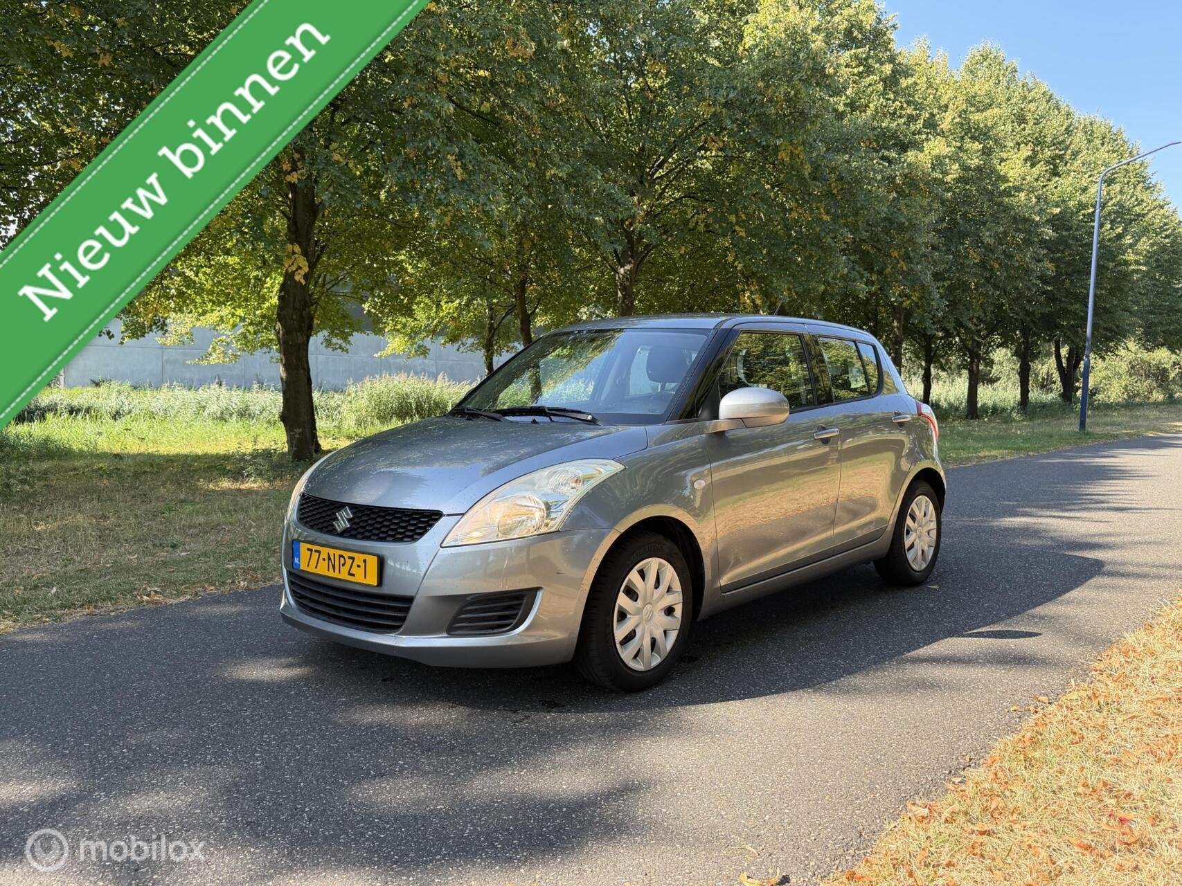 Suzuki Swift 1.2 Comfort*NEW APK 08/27*AIRCO*STOELVERWARMING, Auto's, Voorwielaandrijving, Stof, 4 cilinders, 400 kg
