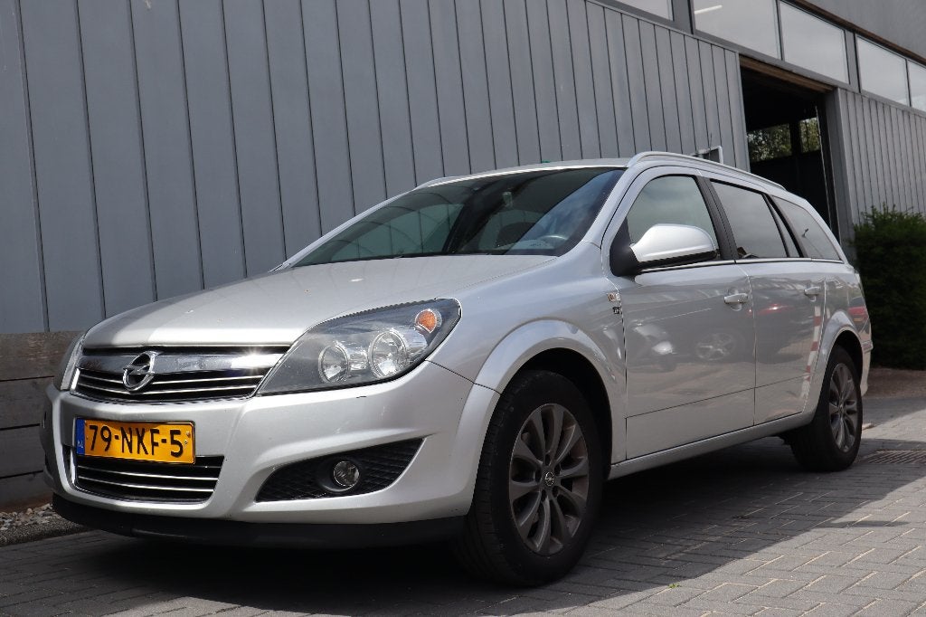 Opel Astra 1.6 16V 85KW St.wgn. 2010 | HANDEL / EXPORT |, Auto's, Voorwielaandrijving, Zwart, Origineel Nederlands, 1100 kg
