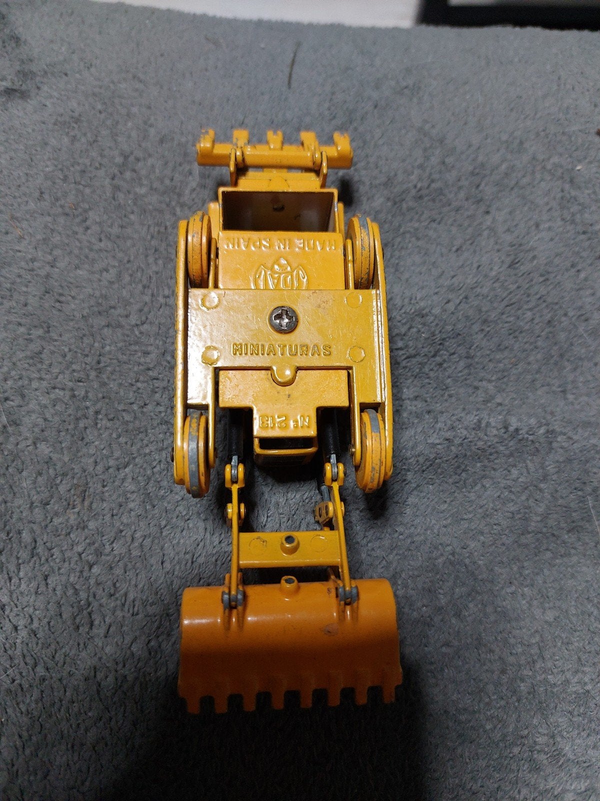 Caterpillar 955 Traxcavator schaalmodel - Made in Spain, Ophalen of Verzenden, Gebruikt