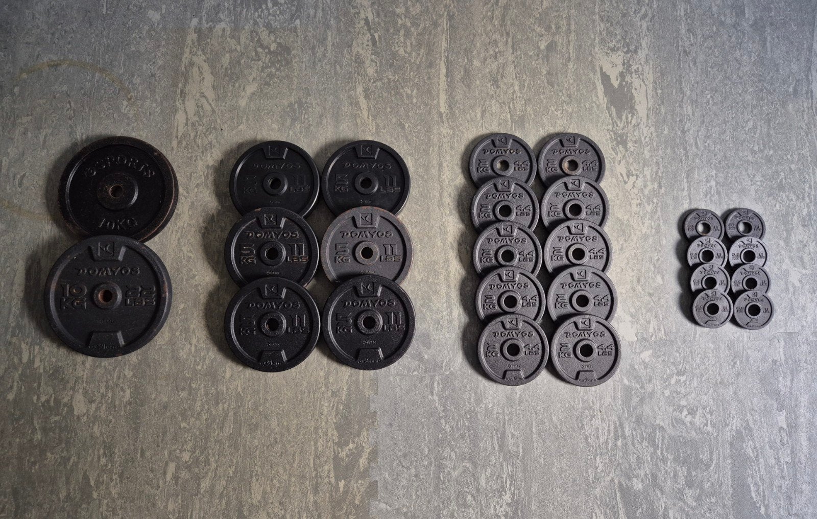 Halterschijven Set 74KG – 28mm – Gietijzer & Rubber, Ophalen of Verzenden, Gebruikt, Benen, Halterschijven