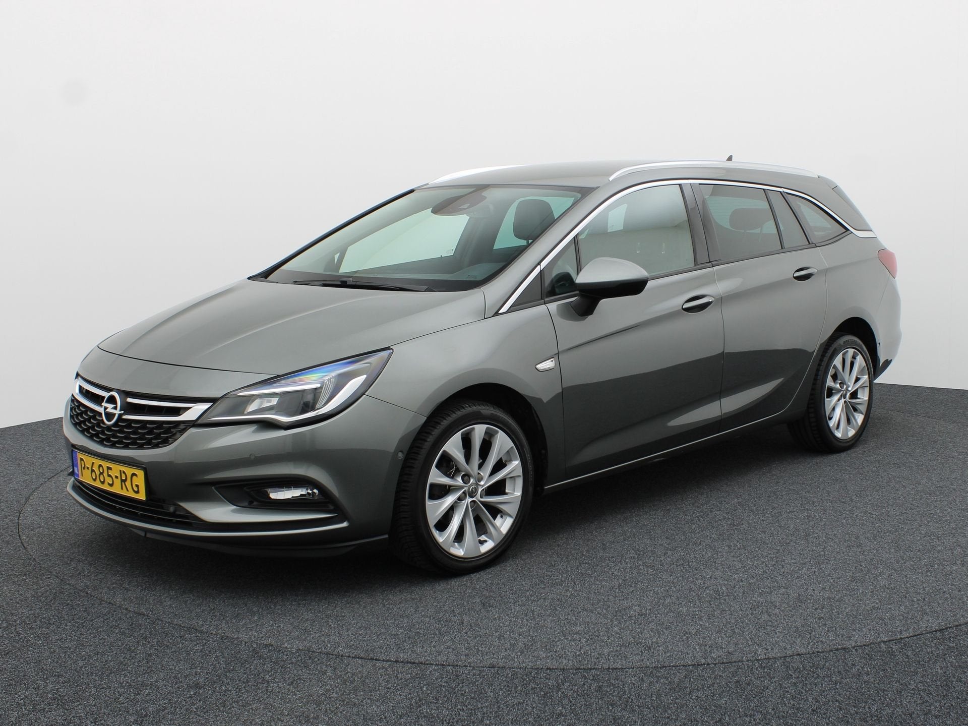 Opel Astra Sports Tourer 1.4 Turbo Innovation | Trekhaak | E, Auto's, Opel, Voorwielaandrijving, 12 maanden, Gebruikt, Leder en Stof
