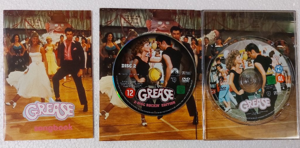 Grease 2xDVD deluxe editie John Travolta Olivia Newton John, Gebruikt, Actiefiguur of Pop, Verzenden, Grease